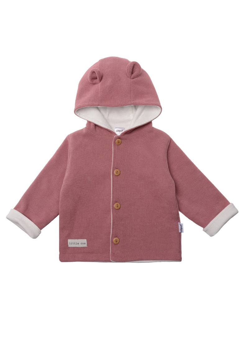 Ribgebreid vest in rozenhout